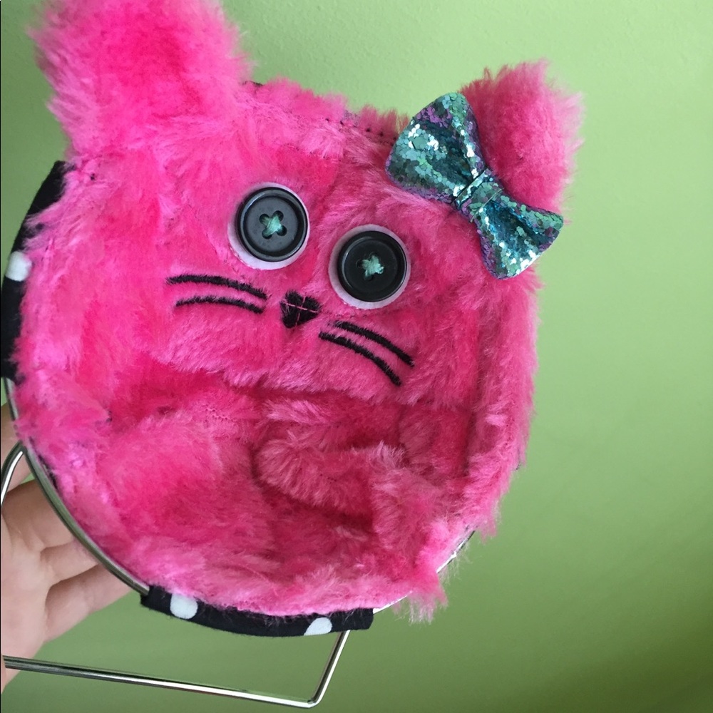 a pink furry cat to put your phone on